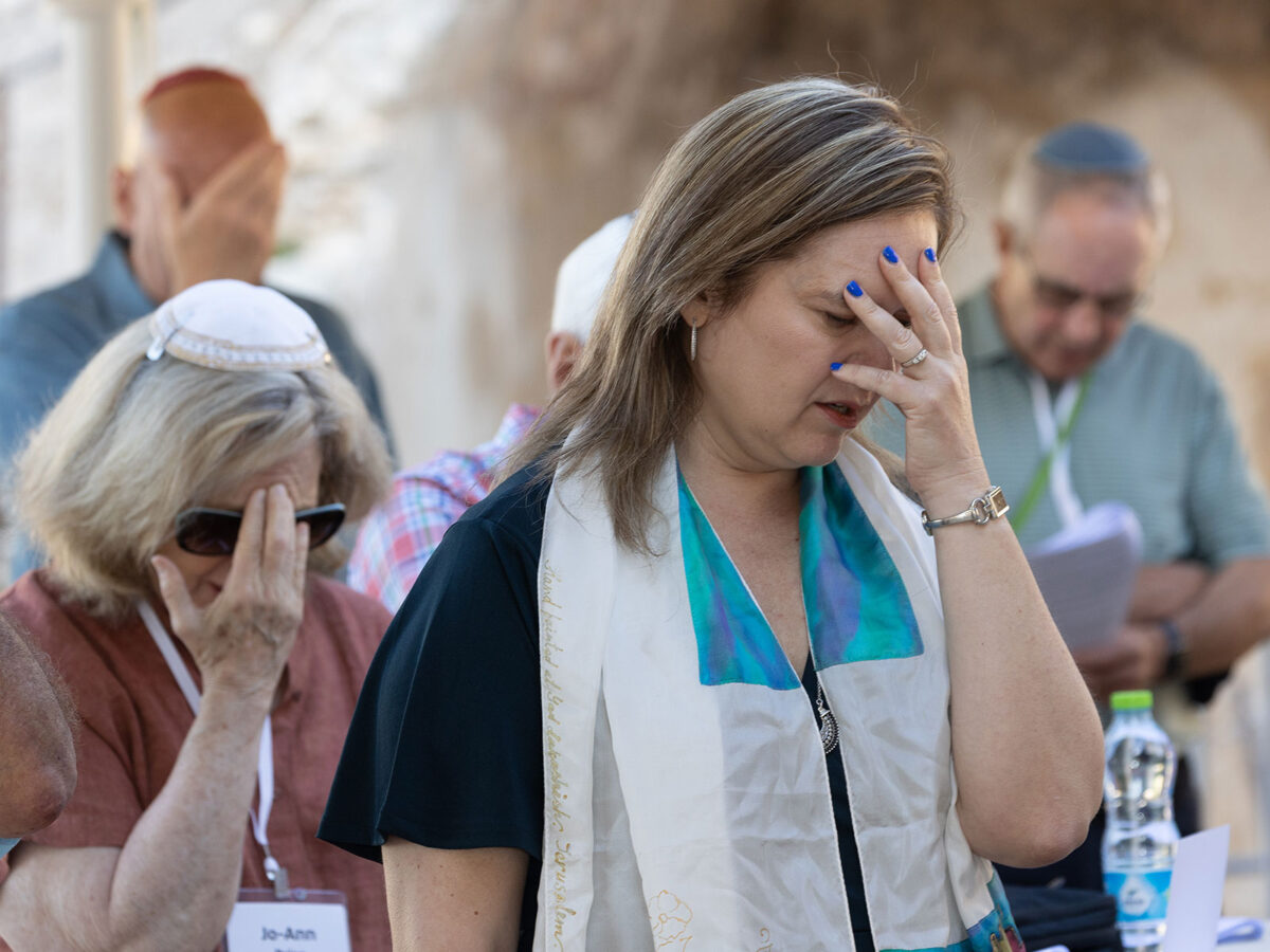 A woman praying at the Western Wall in Jerusalem