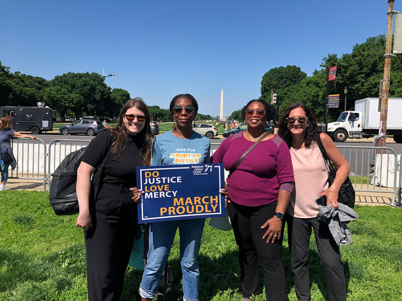 four women at a march in Washington, DC